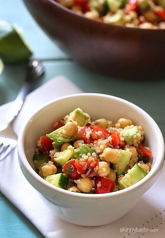 Quinoa chickpea and avocado salad with cucumbers, tomatoes, red onion, lime juice and cilantro – a flavorful vegetarian salad loaded with protein, fiber and healthy fats. 