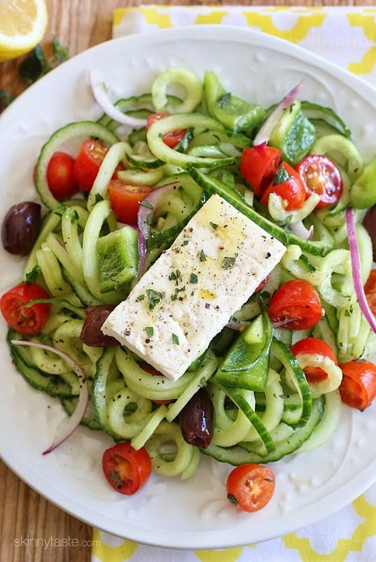 Greek Cucumber Salad with Lemon and Feta Spiralized Greek Cucumber Salad with Lemon and Feta is delicious, the perfect light dish. In Greece, Greek salads do not have lettuce, instead they are made with fresh cucumber, tomatoes, bell pepper, olives, red onion, oregano, lemon juice, olive oil, and fresh feta – delicious! Rather than chopping my cucumbers, I spiralized them which is so much quicker and pretty too!