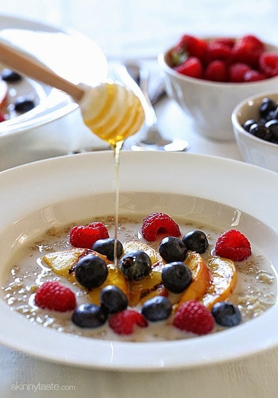 These Summer Quinoa Breakfast Bowls are my favorite! Served as a warm cereal topped with fresh fruit and a drizzle of honey. A healthy protein packed breakfast.