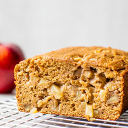 Apple bread on a wire rack.