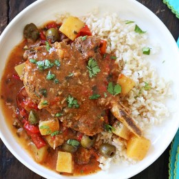 These slow cooker pork chops are seasoned with Latin spices in a flavorful sauce with tomatoes, olives, peppers and potatoes. They literally fall of the bone when they come out of the slow cooker!