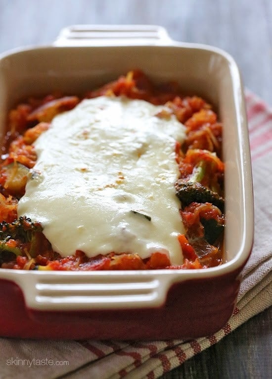 Spaghetti Squash Primavera is made with fresh vegetables simmered with a quick marinara sauce and topped with fresh mozzarella – easy, cheap, gluten-free and perfect for Meatless Mondays!