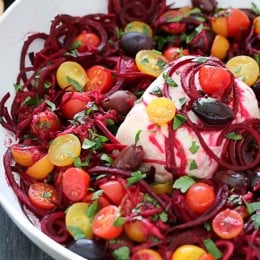 Beet noodles baked with tomatoes, red onion, olives and Feta. Serve this as an appetizer with some baked pita chips, as a side dish or even as a main dish, topped with grilled shrimp or chicken – this dish is a keeper!