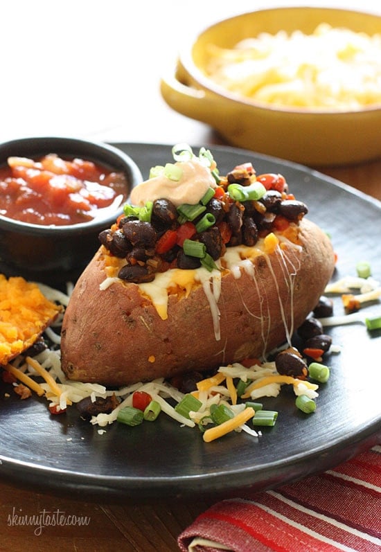 Loaded Baked Sweet Potato Loaded Vegetarian Baked Sweet Potato are Mexican-inspired, loaded with zesty black beans, melted cheese, salsa with a dollop of cream. What can be better than a 20 minute meal!