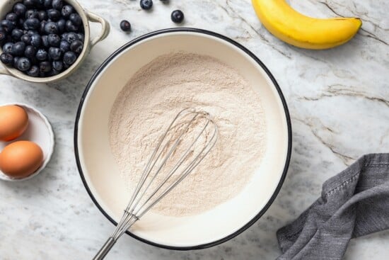 This blueberry banana bread is a lighter twist on a classic that’s perfect for breakfast, snacking, or anytime you have ripe bananas to use! Whisk in bowl with dry ingredients.