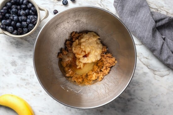 This blueberry banana bread is a lighter twist on a classic that’s perfect for breakfast, snacking, or anytime you have ripe bananas to use! Wet ingredients for blueberry banana bread in bowl.