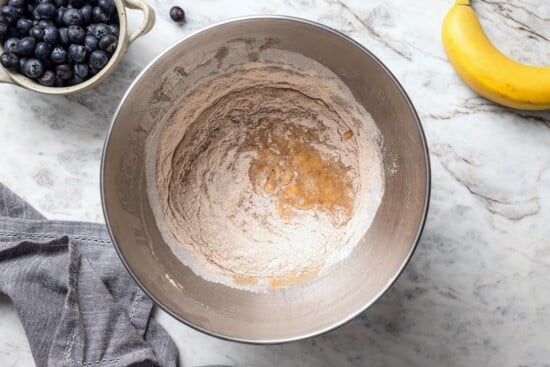 This blueberry banana bread is a lighter twist on a classic that’s perfect for breakfast, snacking, or anytime you have ripe bananas to use! Dry ingredients added to wet ingredients for banana bread.