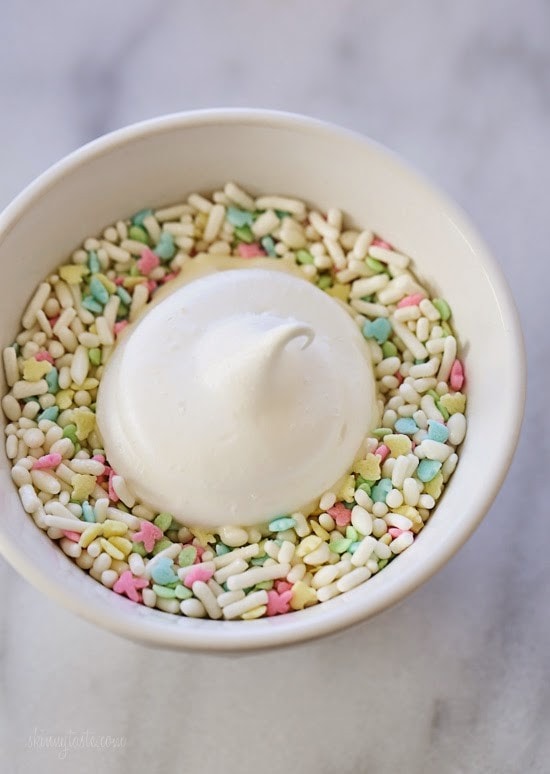 Sprinkle Dipped Meringues Sprinkle Dipped Meringues – Melt-in-your-mouth meringues dipped in white chocolate and sprinkles!