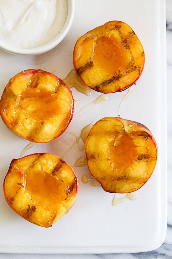 Grilled Peaches With Honey and Yogurt Nothing says summer like biting into a juicy peach. Grilling them is a simple way to enjoy them as a dessert, a perfect ending to a backyard BBQ without heating up your kitchen. Delicious topped with yogurt and honey, but also great topped with low fat ice cream.
