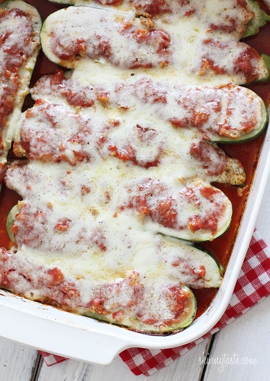 These Italian sausage stuffed zucchini boats are cheesy, flavorful, and a great way to turn summer zucchini into a satisfying dinner! Sausage stuffed zucchini boats in casserole dish.