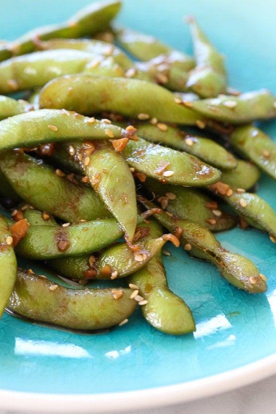 Spicy Garlic Edamame Asian Spicy Garlic Edamame is a flavor explosion in your mouth! An easy, totally addicting snack or side dish!