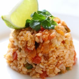 This Quick Mexican Brown Rice is the perfect side dish that goes with everything from tacos, enchiladas, refried beans –you name it!