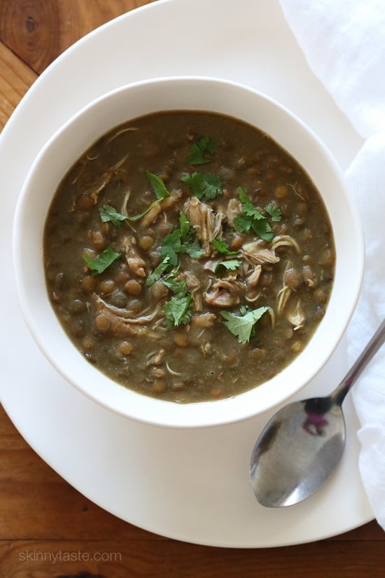 Hearty and nourishing, this Instant Pot Lentil Soup with Chicken comes together in just 30 minutes with a handful of ingredients. Overhead view of a bowl of Instant Pot lentil soup