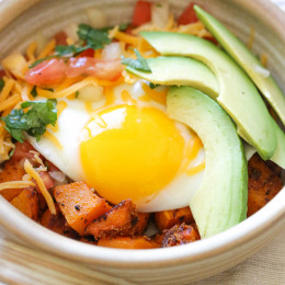 A healthy Mexican-inspired breakfast burrito bowl made with roasted butternut squash, pico de gallo, egg and avocado.