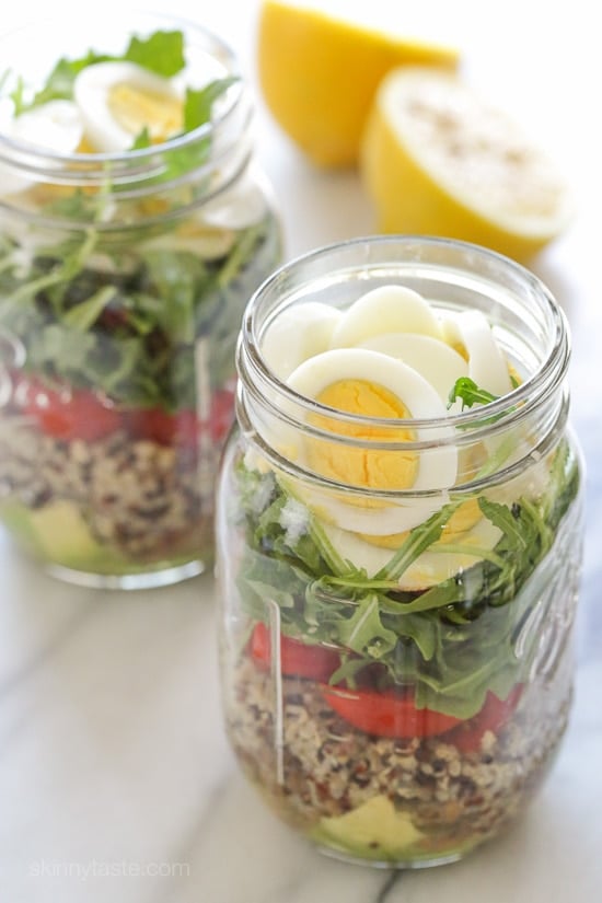 A protein-packed meatless salad in a jar made with quinoa, lentils, arugula, avocado and hard boiled eggs are perfect to pack for work, the beach, picnics, or anywhere you need a portable lunch on the go.