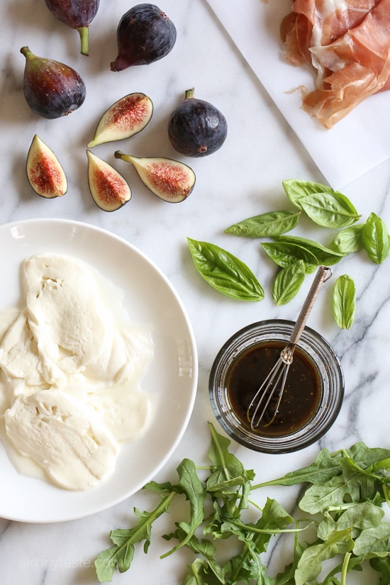 Figs and Prosciutto, savory and sweet they're a match made in heaven! Add some fresh mozzarella, peppery arugula and balsamic dressing and this salad will make you swoon with every bite.