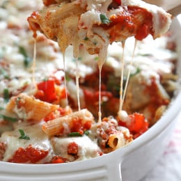 Penne baked with cheese, sauce and loaded with healthy vegetables in every bite. Roasted zucchini, red bell peppers, asparagus, red onion and fennel are tossed with balsamic and herbs then roasted for the best tasting meatless baked pasta dish EVER!