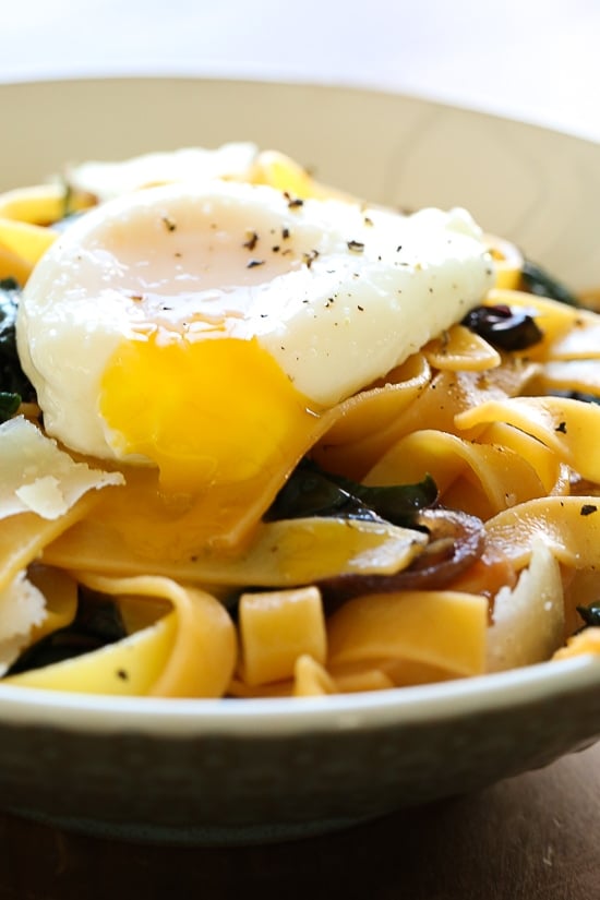 Fettuccini with Winter Greens and Poached Egg is an easy, pantry dinner recipe that take under 15 minutes and perfect if you're on a budget.