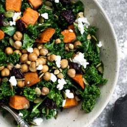 Kale Salad with Roasted Sweet Potato, Dried Cherries, Feta & Pepitas