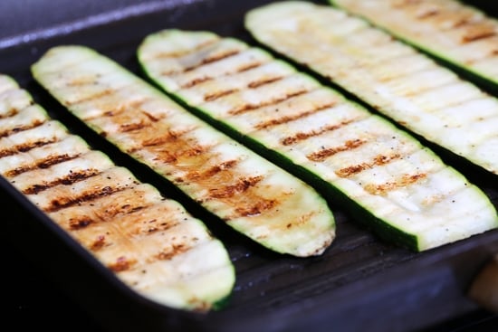 Noodle-less Zucchini Rollatini is low-carb and delicious! Made with strips of grilled zucchini stuffed with a basil-cheese filling, then rolled and topped with marinara, mozzarella and baked in the oven until the cheese is hot and melted.