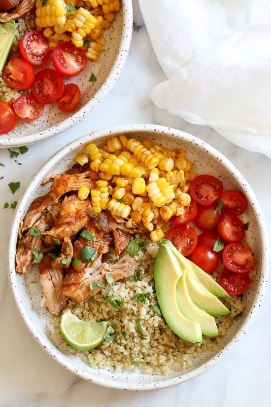 These Chipotle Chicken Bowls with Cilantro Lime Quinoa are so easy to make and have tons of flavor! I like to make them with chicken thighs but if you prefer white meat, chicken breast would work too. Extra limes for squeezing on top are recommended!