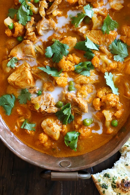 This Instant Pot Chicken Tikka Masala with cauliflower and peas is a lightened up, dairy-free version of the classic Indian curry. Overhead view of chicken tikka masala