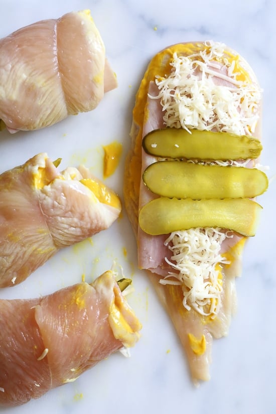 This Cubano Chicken Roll Up idea came to me after having a serious pickle craving! I wanted to make a hot dish utilizing dill pickles in some way and decided to stuff a chicken breast with everything you'd normally find in a Cuban Sandwich – pickles, mustard, Swiss, and ham. But I took it a step further and brined the cutlets overnight in pickle juice for extra flavor, the results were outstanding!!!