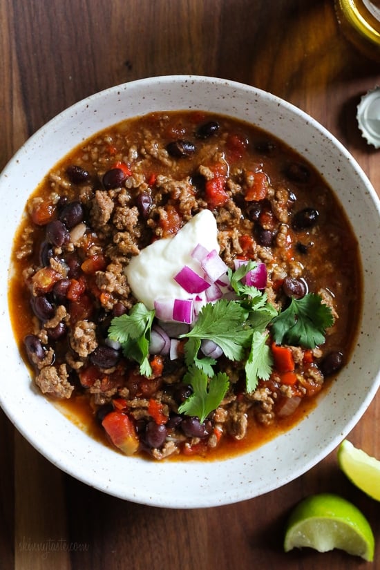 Hearty, filling, and ready in an hour, this is truly the best chili recipe! Made with beans, beef, and a blend of spices. A bowl of the best chili recipe, topped with sour cream