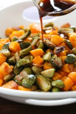 Roasted Brussels Sprouts and Butternut Squash are delicious on their own, but adding bacon and a maple soy glaze makes them over-the-top delicious! Made all on one sheet pan, you can double or triple this recipe to feed a crowd by adding more sheet pans.
