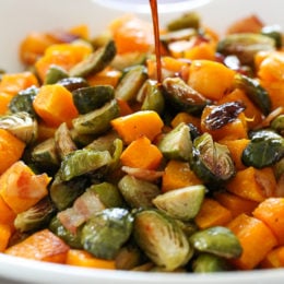 Roasted Brussels Sprouts and Butternut Squash are delicious on their own, but adding bacon and a maple soy glaze makes them over-the-top delicious! Made all on one sheet pan, you can double or triple this recipe to feed a crowd by adding more sheet pans.