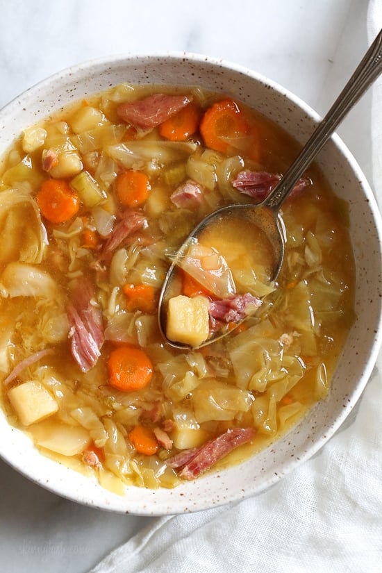 If you’re looking for leftover ham recipes, you’ll love this leftover ham bone and potato soup! It’s hearty, flavorful, and easy to make too. Overhead view of ham and potato soup made with leftover ham bone