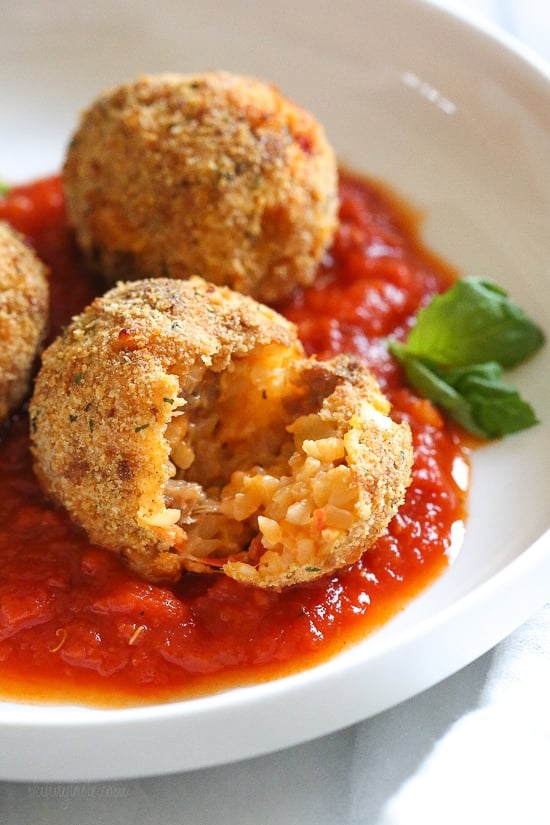 These Italian Cauliflower Rice Balls (Arancini) are made with cauliflower in place of rice! Lower in carbs and baked or made in the air fryer!