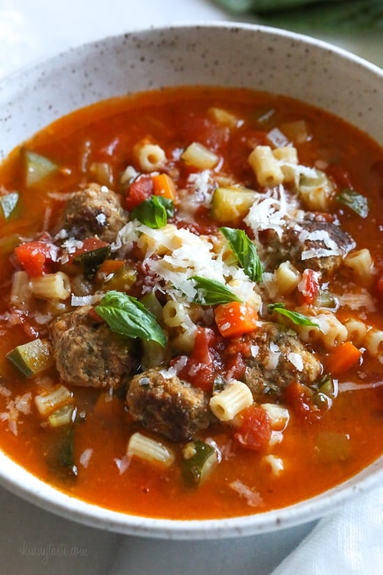 Instant Pot Turkey Meatball Soup is loaded with mini turkey meatball, zucchini, vegetables, and ditalini pasta. Hearty and healthy! A white bowl of turkey meatball soup