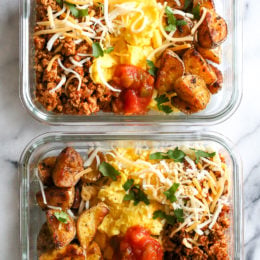 Breakfast lovers, jazz up your mornings with this Meal Prep Breakfast Taco Scramble, made with potatoes, turkey taco meat, scrambled eggs and salsa (cheese is optional!) perfect to make ahead for breakfast for the week!