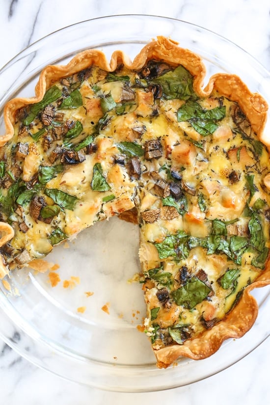 This easy lighter chicken quiche is made with refrigerated pie crust and loaded with spinach and mushrooms but you can use any combination of vegetables. A great recipe to clean out the refrigerator!