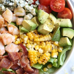 This hearty Chopped Salad with Shrimp, Avocado, Blue Cheese and Bacon is simple and satisfying. Great for lunch or dinner!