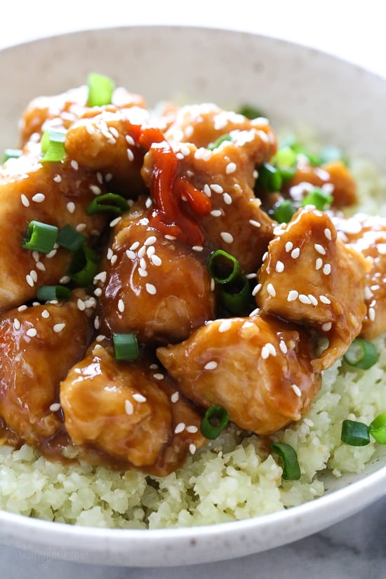 Healthy General Tso's chicken served over cauliflower rice