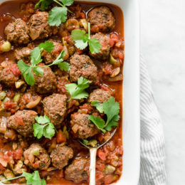 Moroccan Kefta Meatballs made with tomatoes and olives are simmered together in the slow cooker or Instant Pot in this easy and exotic Moroccan dinner. Whole30, gluten-free and Paleo.