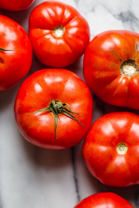 Ripe, end-of-summer garden tomatoes make the best, juiciest tomato salad, perfect served with a rustic loaf of bread!
