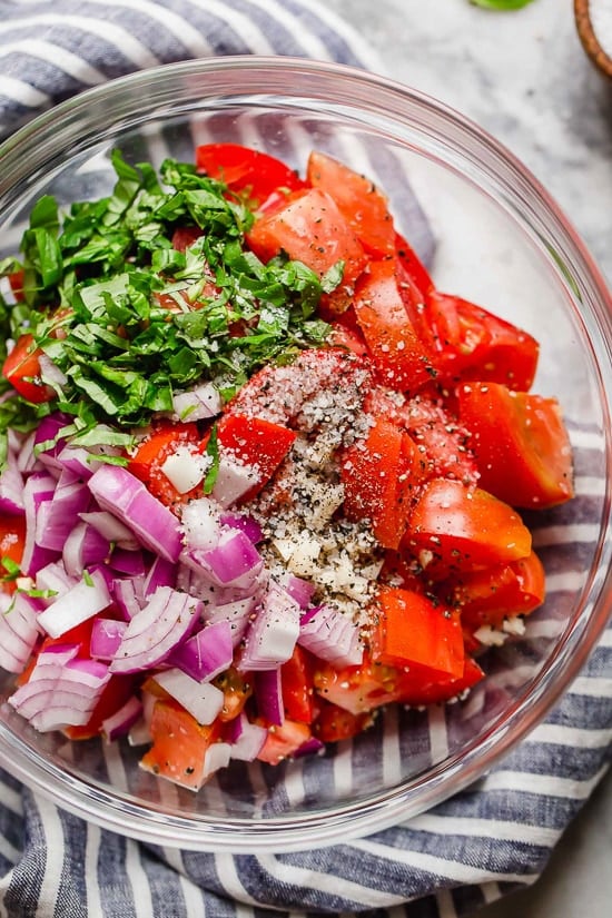 Ripe, end-of-summer garden tomatoes make the best, juiciest tomato salad, perfect served with a rustic loaf of bread!