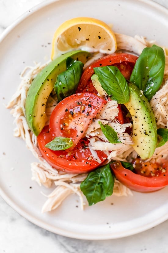 This quick and easy chicken salad is made with the breast meat of a Rotisserie chicken, avocados, fresh tomatoes, basil and lemon juice.