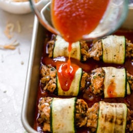 These Low-Carb Chicken Enchilada Roll Ups are made with zucchini in place of tortillas! Delicious, and perfect for Keto, gluten-free or low-carb diets.