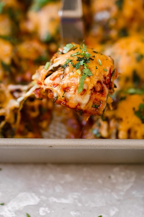 These Zucchini Chicken Enchilada Roll Ups are filled seasoned shredded chicken, topped with enchilada sauce and cheese. Delicious, and perfect for Keto, gluten-free or low-carb diets.