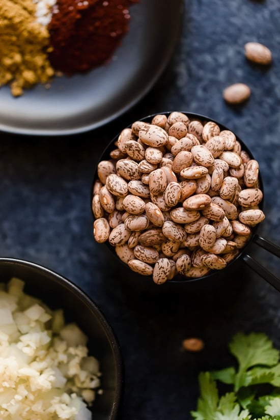 These Instant Pot Refried Beans are a simple, healthy, and fat-free version of the classic Mexican side dish. No oil or lard required! A cup of pinto beans
