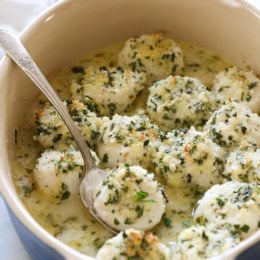 These quick and easy baked sea scallops are topped with panko and Parmesan in a simple lemon-butter sauce.
