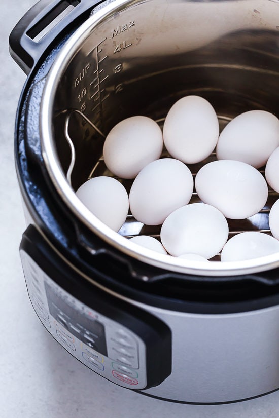 These Instant Pot Deviled Eggs are quick and easy, with a creamy egg yolk filling and a hint of paprika on top. Perfect for potlucks! Hard boiled eggs in the Instant Pot