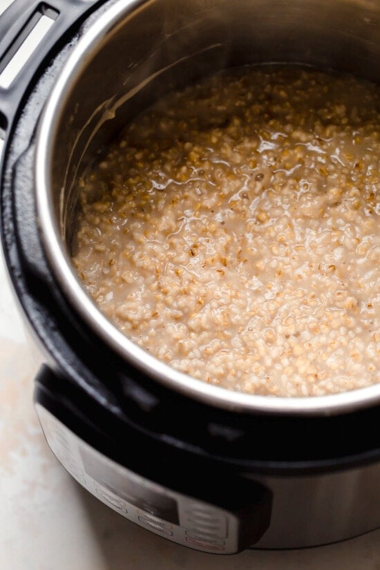 Instant Pot steel cut oats are so much faster than making them on the stove! Learn how to cook steel cut oats for a warm, hearty breakfast. Steel cut oats in the Instant Pot