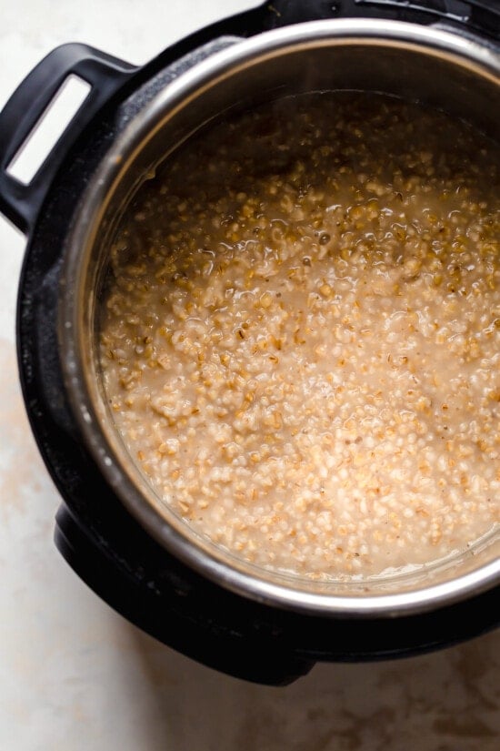 Instant Pot steel cut oats are so much faster than making them on the stove! Learn how to cook steel cut oats for a warm, hearty breakfast. An Instant Pot of steel cut oats