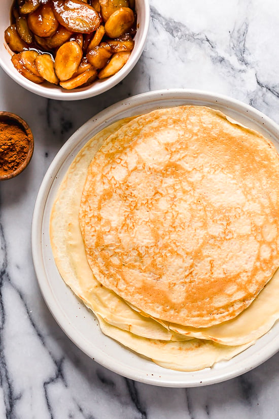 Banana Foster Dessert Crepes are made with two of my favorite desserts – homemade crepes and bananas fosters, combined into one! This skinny make-over won't wreak havoc on your weekly calorie intake.