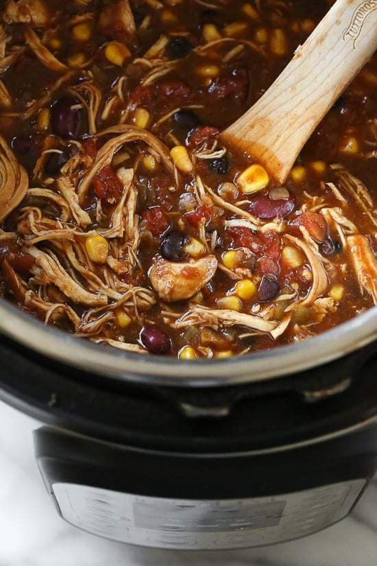 This easy and healthy Instant Pot Chicken Taco Chili is made with chicken, beans, corn and tomatoes and taco seasoning. Chicken Taco Chili, made with chicken, beans, corn and tomatoes seasoned with taco seasoning is one of my most popular slow cooker recipes, which I just remade for Instant Pot after several requests! This recipe couldn’t be easier, made with ingredients you probably already have in your pantry.